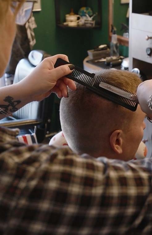 Barber cutting hair