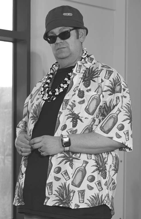 Man with sunglasses and Hawaiian shirt