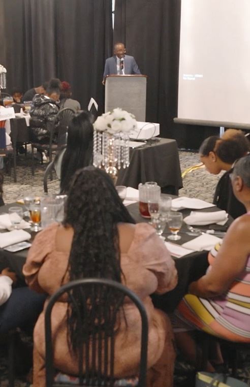 Judge Onzlee Ware speaking to apprentices and families.